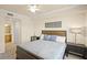 Bedroom featuring a full bed and a view into the ensuite bathroom at 7015 River Hammock Dr # 204, Bradenton, FL 34212