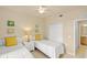 Bedroom with two twin beds, closet, and entry into the ensuite bathroom at 7015 River Hammock Dr # 204, Bradenton, FL 34212