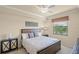 Comfortable bedroom featuring a ceiling fan and a framed headboard bed set at 7015 River Hammock Dr # 204, Bradenton, FL 34212
