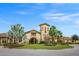 Elegant clubhouse exterior with stone accents, lush landscaping, and a welcoming entrance at 7015 River Hammock Dr # 204, Bradenton, FL 34212