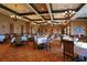 Formal dining room with elegant chandeliers, beautifully set tables, and a sophisticated ambiance at 7015 River Hammock Dr # 204, Bradenton, FL 34212