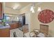 Kitchen and dining area with granite countertops, stainless steel appliances, and breakfast table at 7015 River Hammock Dr # 204, Bradenton, FL 34212