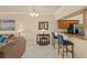 Open floor plan with a view into the kitchen and breakfast bar at 7015 River Hammock Dr # 204, Bradenton, FL 34212