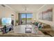Inviting living room with large windows and scenic view at 7015 River Hammock Dr # 204, Bradenton, FL 34212