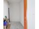 Empty storage room with cinderblock walls and an open house sign at 7015 River Hammock Dr # 204, Bradenton, FL 34212