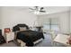 Bright bedroom featuring light walls, carpet and a window at 7401 S Gator Creek Blvd, Sarasota, FL 34241