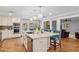 Island kitchen with stainless steel appliances, and hardwood flooring creates a culinary space at 7401 S Gator Creek Blvd, Sarasota, FL 34241