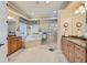 Elegant bathroom with a soaking tub, walk-in shower, and granite countertops at 8004 River Preserve Dr, Bradenton, FL 34212