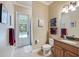 Light-filled bathroom featuring a granite vanity, with access to the pool area at 8004 River Preserve Dr, Bradenton, FL 34212