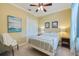 Bright bedroom with a ceiling fan, neutral walls, and ample closet space at 8004 River Preserve Dr, Bradenton, FL 34212