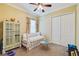 Comfortable bedroom with a ceiling fan, closet, and charming decor at 8004 River Preserve Dr, Bradenton, FL 34212