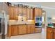 Spacious kitchen with stainless steel appliances, wood cabinets and granite countertops at 8004 River Preserve Dr, Bradenton, FL 34212