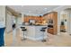 Kitchen featuring stainless steel appliances, granite countertops and breakfast bar with seating at 8004 River Preserve Dr, Bradenton, FL 34212