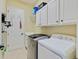 Functional laundry room with modern appliances and ample storage space at 8004 River Preserve Dr, Bradenton, FL 34212