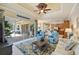 Comfortable living room featuring tile floors, ceiling fan and lots of light at 8004 River Preserve Dr, Bradenton, FL 34212