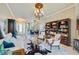 Bright living room with a view of the dining area and a large bookshelf, providing ample storage at 8004 River Preserve Dr, Bradenton, FL 34212