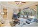 Comfortable living room with view of the screened in pool and patio at 8004 River Preserve Dr, Bradenton, FL 34212