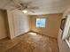 Bedroom with plywood flooring, ceiling fan and closet at 808 53Rd E Ave # 273, Bradenton, FL 34203
