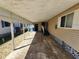 Spacious carport area offering convenient covered parking and protection from the elements, plus storage and entry to home at 808 53Rd E Ave # 273, Bradenton, FL 34203