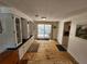 Open dining area leading to a screened-in patio, featuring built-in cabinetry and natural light at 808 53Rd E Ave # 273, Bradenton, FL 34203