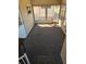 Enclosed Florida room with outdoor views, featuring neutral carpets and ceiling fan, for relaxing and entertaining at 808 53Rd E Ave # 273, Bradenton, FL 34203