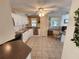 Well-equipped kitchen with modern appliances, tile floors, and an eat-in desk area at 808 53Rd E Ave # 273, Bradenton, FL 34203