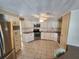 Bright kitchen with stainless steel appliances and ample storage in white cabinetry at 808 53Rd E Ave # 273, Bradenton, FL 34203