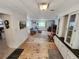 Spacious living room with an open floor plan, views of the outdoors, and access to other rooms at 808 53Rd E Ave # 273, Bradenton, FL 34203