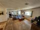 Inviting living room featuring a comfortable sofa and natural light from large windows at 808 53Rd E Ave # 273, Bradenton, FL 34203