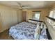 Main bedroom featuring a large bed, closet and mirror at 808 53Rd E Ave # 273, Bradenton, FL 34203