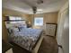 Bedroom with a bed, dresser and ceiling fan at 808 53Rd E Ave # 273, Bradenton, FL 34203