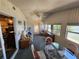 Relaxing sunroom with a seating area, dining table, and views to the outdoor living, perfect for casual living at 808 53Rd E Ave # 273, Bradenton, FL 34203