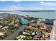Stunning aerial view of property highlighting waterfront location, lush landscaping, and neighborhood at 813 Hudson Ave, Sarasota, FL 34236