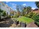 Spacious backyard with lush green grass and well-manicured landscaping, perfect for outdoor gatherings at 813 Hudson Ave, Sarasota, FL 34236