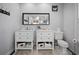 Bathroom with double vanity, tiled floor, and modern fixtures for a clean, contemporary design at 813 Hudson Ave, Sarasota, FL 34236