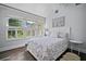 This bedroom is full of light with large windows, a vaulted ceiling, and light walls at 813 Hudson Ave, Sarasota, FL 34236
