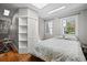 Bright bedroom with shiplap accent wall, skylight, and plenty of natural light at 813 Hudson Ave, Sarasota, FL 34236