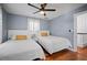 This well-lit guest bedroom includes two twin beds, hardwood floors, and a large window for ample light at 813 Hudson Ave, Sarasota, FL 34236