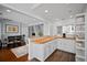 Well-designed kitchen with an island, counter seating, and seamless flow to dining area at 813 Hudson Ave, Sarasota, FL 34236