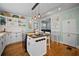 Charming kitchen with custom cabinets, central island, and stainless appliances at 813 Hudson Ave, Sarasota, FL 34236