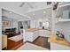Spacious kitchen open to the dining room with white cabinets and wood countertops at 813 Hudson Ave, Sarasota, FL 34236
