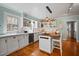 Beautiful kitchen with white cabinetry, wood countertops and stainless appliances at 813 Hudson Ave, Sarasota, FL 34236