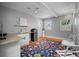 Modern kitchenette with open shelving, mini fridge and granite counters at 813 Hudson Ave, Sarasota, FL 34236