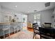 Open kitchen and dining area featuring a breakfast bar, pendant lighting, and hardwood floors at 813 Hudson Ave, Sarasota, FL 34236