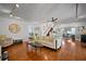 Open-concept living room with staircase, hardwood floors and neutral decor at 813 Hudson Ave, Sarasota, FL 34236