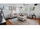 Bright and airy living room with comfortable seating, ceiling fan, and plenty of natural light at 813 Hudson Ave, Sarasota, FL 34236