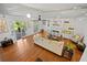 Bright living room with hardwood floors, fireplace, and comfortable seating, ideal for relaxation at 813 Hudson Ave, Sarasota, FL 34236