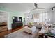 Comfortable living room with stylish decor, large TV, modern furniture, and lots of light at 813 Hudson Ave, Sarasota, FL 34236