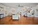 Spacious living room with hardwood floors, fireplace, staircase and neutral decor at 813 Hudson Ave, Sarasota, FL 34236