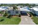 An aerial image capturing a charming home nestled in a serene residential neighborhood at 8424 Regal Way, Palmetto, FL 34221